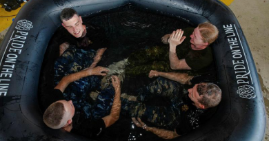 RAAF Security and Fire School students take an ice bath after conducting firefighting training – a measure of recovery and rehabilitation introduced by the Human Performance Optimisation team. Story by Corporal Melina Young. Photos by Peter Longland.