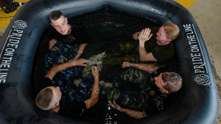 RAAF Security and Fire School students take an ice bath after conducting firefighting training – a measure of recovery and rehabilitation introduced by the Human Performance Optimisation team. Story by Corporal Melina Young. Photos by Peter Longland.