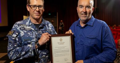 Leading Aircraftman Thomas Finlayson (left) with the Gold Commendation he received for providing first aid assistance to Jeff Goodwin (right), during the Warrant Officer of the Air Force visit to RAAF Base Richmond. Story by Mrs Tastri Murdoch. Photos by LAC Chris Tsakisiris.