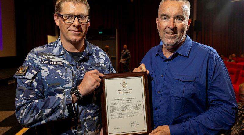 Leading Aircraftman Thomas Finlayson (left) with the Gold Commendation he received for providing first aid assistance to Jeff Goodwin (right), during the Warrant Officer of the Air Force visit to RAAF Base Richmond. Story by Mrs Tastri Murdoch. Photos by LAC Chris Tsakisiris.