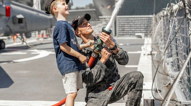 Able Seaman Peter Mason demonstrates fire-fighting hose techniques onboard HMAS Arunta during Fleet Base East's open day, Sydney. Story by Lieutenant Marie Davies. Photos by Able Seaman Lucinda Allanson.