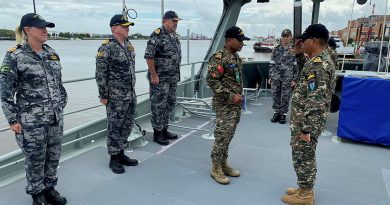 Timor-Leste Defence Force Lieutenant Jacinto Do Nascimento salutes Lieutenant Clementino Colo ahead of his promotion on board PT Paluma. Story by Richard Wilkins.