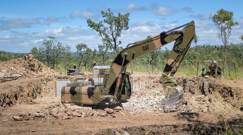 Soldiers from 3rd Combat Engineer Regiment use an excavator to construct a bunker during Exercise Brolga Walk at Townsville Field Training Area, Queensland. Story by Corporal Luke Bellman. Photo by Trooper Dana Millington.