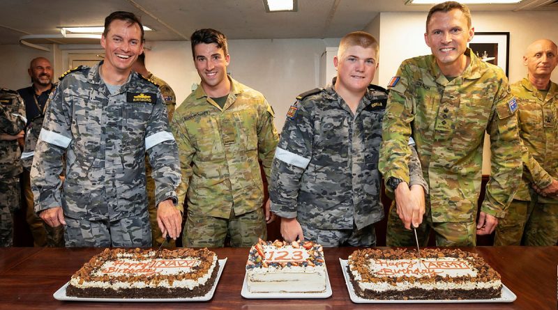 From left, Commanding Officer HMAS Stuart Commander Richard Raymond, Sapper Sean Egan-Richards, Seaman Thomas Brum and Australian Defence Adviser to Fiji Army Colonel Henry Stimson cut the 123rd birthday for cakes for Navy and Army on board HMAS Stuart while at anchor in Suva, Fiji. Story by Lieutenant Commander Andrew Herring. Photos by Leading Seaman Rikki-Lea Phillips.