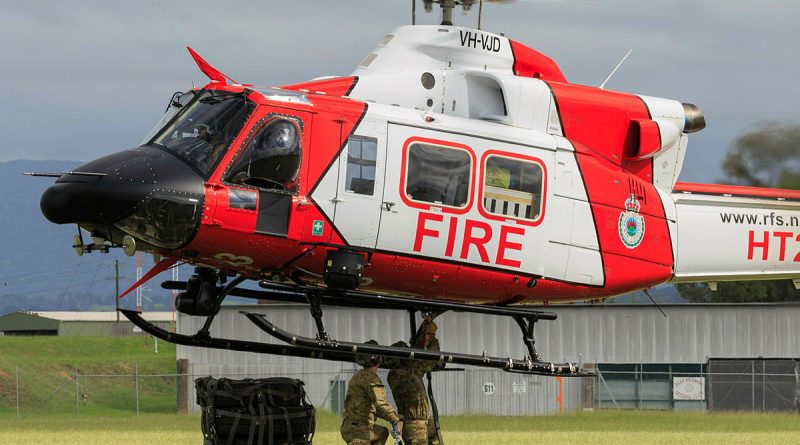 Army soldiers prepare cargo for an airlift by the Rural Fire Service helicopter. Story by Corporal Luke Bellman. Photos by Warrant Officer Robert Spooner.