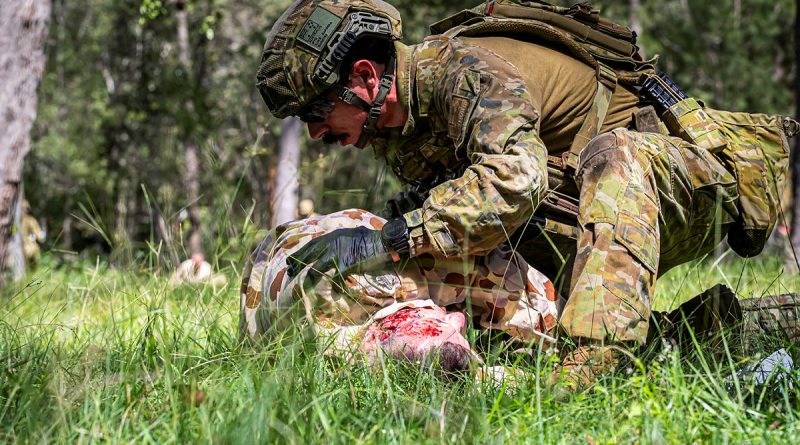 An Army medic from 2nd Health Battalion gives emergency medical care to simulated casualties during Exercise Viper Walk. Story and photos by Corporal Melina Young.