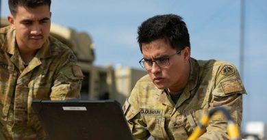 Signallers Harley Leggett and Lachlan Colquhoun set up a communications tower during Project Convergence Capstone 4 at Camp Pendleton, California. Story by Lieutenant Colonel Carrie Robards. Photo by US Army Specialist Marquis McCants.