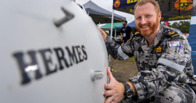 Chief Petty Officer David Dillon with the Schiebel S-100 Camcopter "Hermes" during the Airshows Downunder Shellharbour at Shellharbour Airport Career Day. Story by Pilot Officer Shanea Zeegers. Photo by Leading Aircraftman Chris Tsakisiris.
