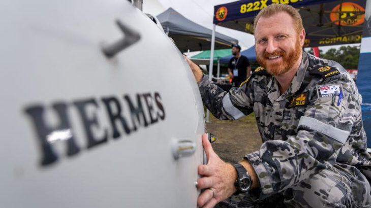 Chief Petty Officer David Dillon with the Schiebel S-100 Camcopter "Hermes" during the Airshows Downunder Shellharbour at Shellharbour Airport Career Day. Story by Pilot Officer Shanea Zeegers. Photo by Leading Aircraftman Chris Tsakisiris.