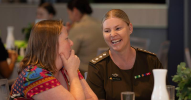 Australian Army officer Captain Pamela Truscott speaks with a fellow guest at the Working Spirit/RSL Western Australia International Women's Day lunch. Story by Major Dean Benson. Photo by Corporal Nakia Chapman.