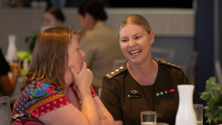 Australian Army officer Captain Pamela Truscott speaks with a fellow guest at the Working Spirit/RSL Western Australia International Women's Day lunch. Story by Major Dean Benson. Photo by Corporal Nakia Chapman.
