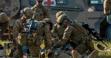 Medics from 2nd Health Brigade simulate rendering first aid to a soldier during a mass casualty exercise in Shoalwater Bay training area, Queensland, in 2023. Story by Captains Prashanth Shanmugan and Nicholas Marquis. Photo by Corporal Nicole Dorrett.