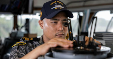 Lieutenant Yoon Lee takes a bearing on the bridge of HMAS Yarra. Story by Lieutenant Geoff Long. Photo by Leading Seaman Jarrod Mulvihill.