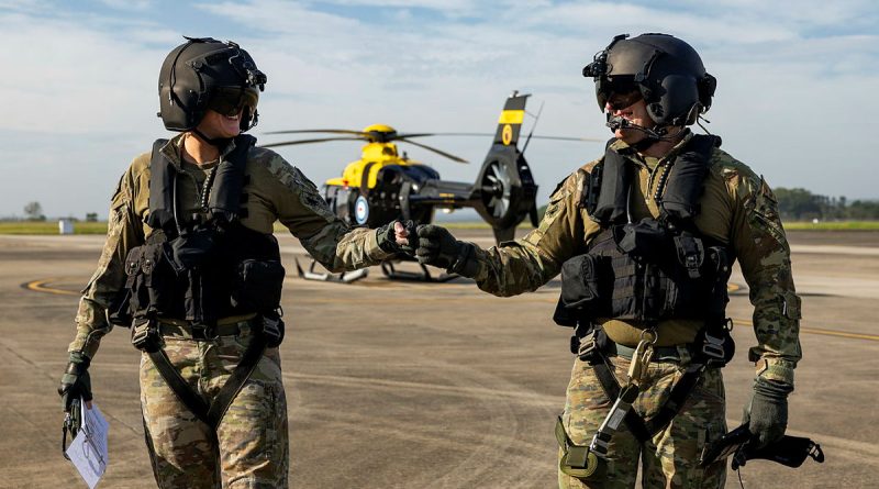 Army helicopter pilot Lieutenant Nicole Ravell and aircrew operator Corporal Corren James, of 723 Squadron, on the flight line at HMAS Albatross. Story by Captain Karam Louli. Photos by Leading Aircraftwoman Emma Schwenke.