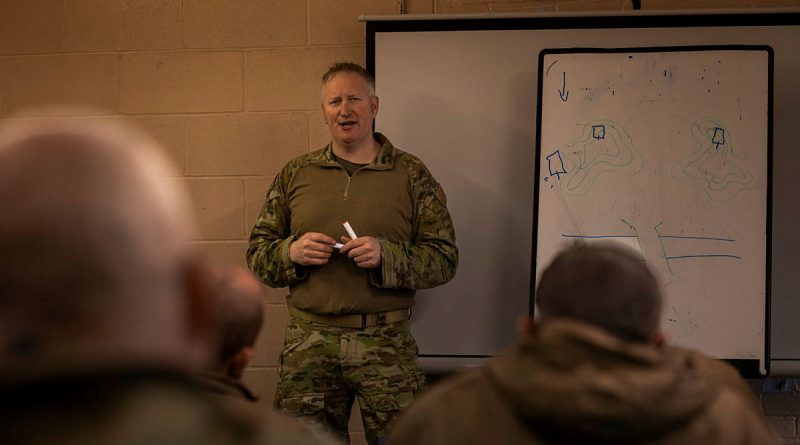 An Australian Army soldier delivers a Platoon and Company Sergeants Battle Course lesson to Armed Forces of Ukraine personnel in the United Kingdom during March for Operation Kudu. (Image has been digitally altered for security purposes.) Story by Lieutenant Carolyn Martin. Photos by Corporal Nicole Dorrett.