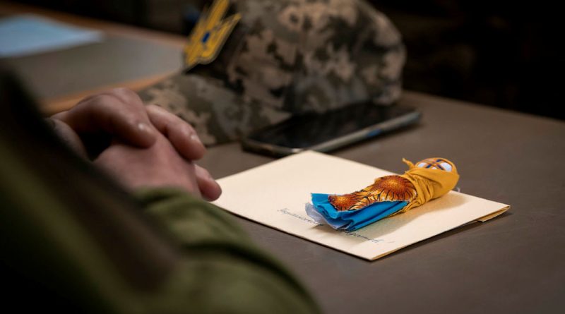 A traditional ceremonial guardian doll and handwritten letter from the Ukrainian community in Australia sits on the desk of a Ukrainian soldier attending an Australian Army-led leadership course in England. Story by Lieutenant Carolyn Martin. Photos by Corporal Nicole Dorrett.