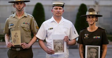 Australia's Federation Guard members, Corporal Michael Byrne, left, Able Seaman Christopher Innis and Corporal Julie Kling with photos of their relatives at the Australian War Memorial, Canberra. Story by Captain Karam Louli. Photos by Leading Seaman Susan Mossop.