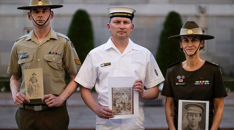 Australia's Federation Guard members, Corporal Michael Byrne, left, Able Seaman Christopher Innis and Corporal Julie Kling with photos of their relatives at the Australian War Memorial, Canberra. Story by Captain Karam Louli. Photos by Leading Seaman Susan Mossop.