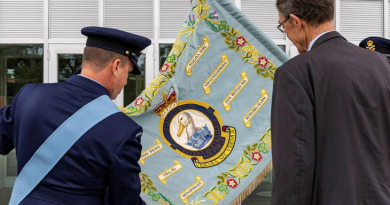 9 Squadron Association patron and former Commanding Officer, Air Chief Marshal (retd) Angus Houston is shown the Squadron Standard following the 9 Squadron reactivation ceremony at RAAF Base Point Cook, Victoria. Story by Pilot Officer Shanea Zeegers. Photo by Leading Aircraftwoman Annika Smit.