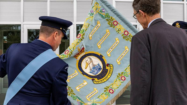 9 Squadron Association patron and former Commanding Officer, Air Chief Marshal (retd) Angus Houston is shown the Squadron Standard following the 9 Squadron reactivation ceremony at RAAF Base Point Cook, Victoria. Story by Pilot Officer Shanea Zeegers. Photo by Leading Aircraftwoman Annika Smit.