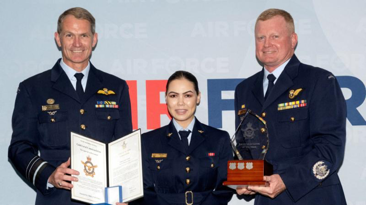 Chief of Air Force Air Marshal Robert Chipman, left and Warrant Officer of the Air Force Ralph Clifton, right, present the Enlisted Aviator of the Year Award to Corporal Kbora Ali. Story by Flying Officer Kate Kiely. Photos by Flight Sergeant Kev Berriman.