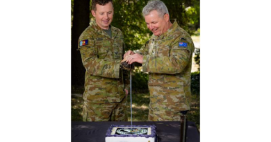 Australian Army Public Relations Service's Corporal Andrew Sleeman and Head of Corps Colonel Jason Logue cut the birthday cake at 1st Joint Public Affairs Unit, Canberra, in celebration of the corps' 30th birthday. Story by Major Lily Mulholland. Photo by Corporal Lisa Sherman.