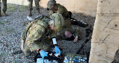 Special operations first-aid course participants assess a casualty role-player and prepare for field medical care under the supervision of Australian and American directing staff. (Images have been digitally altered for security purposes.). Story by Major N.