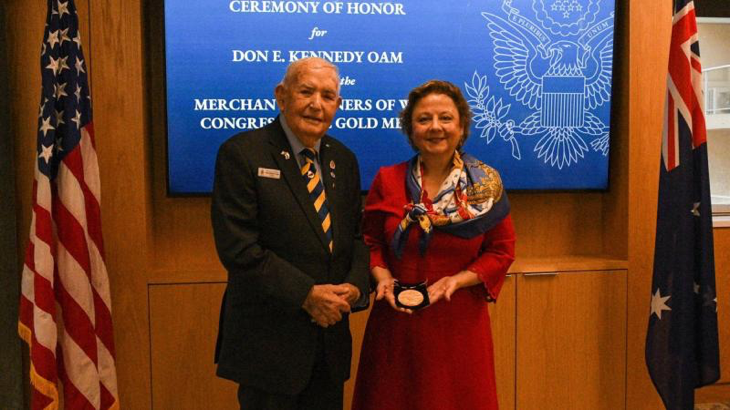 Merchant Navy veteran Don Kennedy receives the Merchant Mariners of WW2 Congressional Gold Medal from US Consul General Christine Elder at a ceremony in Sydney, NSW. Story by Lieutenant Marie Davies.