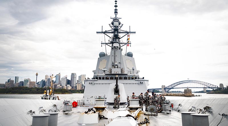 Members of HMAS Hobart’s forecastle party handle lines as the ship departs Fleet Base East, Sydney, before the commencement of their Indo-Pacific Regional Presence deployment. Photo by Leading Seaman Matthew Lyall.