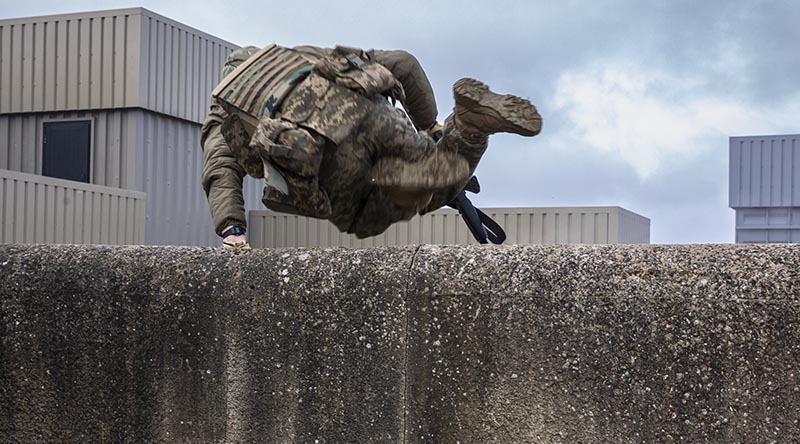 Armed Forces of Ukraine personnel conduct an urban assault, as part of the Platoon and Company Sergeants Battle Course run by Australian Army soldiers deployed on Operation Kudu in the United Kingdom, March 2024. Image has been digitally altered for security purposes.