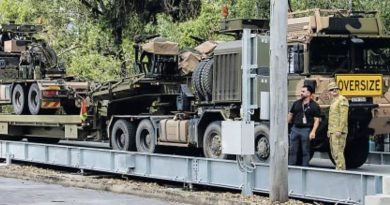 An HX-81 prime mover and trailer is weighed on the newly opened vehicle weighbridge at Gallipoli Barracks. Story by Corporal Michael Rogers.