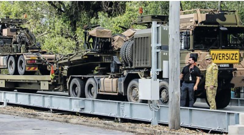 An HX-81 prime mover and trailer is weighed on the newly opened vehicle weighbridge at Gallipoli Barracks. Story by Corporal Michael Rogers.