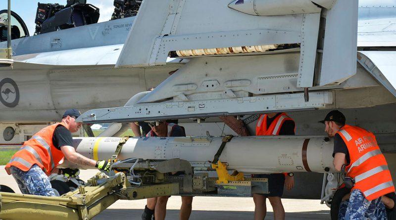 Armament technicians from 1 Squadron load an AGM-84 Harpoon anti-ship missile onto an F/A-18F Super Hornet at RAAF Base Amberley. Story. by Flight Lieutenant Imogen Lunny. Photos by Aircraftwoman Vanessa Wang.