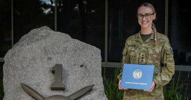 Captain Bronte Franklin with her United Nations Award received during Exercise Freedom Shield, stands outside Headquarters 1st (Australian) Division, Gallipoli Barracks, Brisbane. Story by Captain Peter Nugent. Photo by Corporal Miguel Anonuevo.