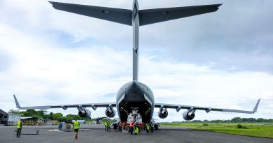 Air Force aviators deployed to Solomon Islands unload a RAAF Boeing C-17 Globemaster III at Honiara Henderson Airport. Story by Major Tom Maclean. Photo by Corporal Dustin Anderson.