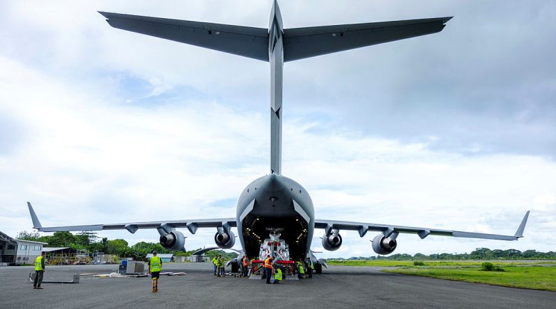 Air Force aviators deployed to Solomon Islands unload a RAAF Boeing C-17 Globemaster III at Honiara Henderson Airport. Story by Major Tom Maclean. Photo by Corporal Dustin Anderson.