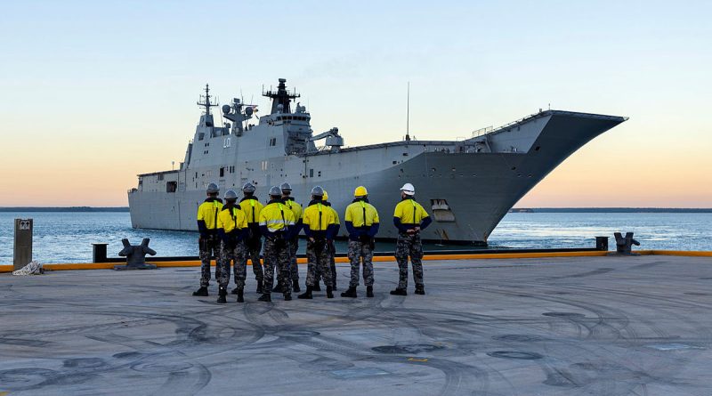 Port Services Darwin members stand by as HMAS Adelaide approaches the newly built Kuru wharf at HMAS Coonawarra in Darwin, NT. Photos by Leading Seaman Ernesto Sanchez.