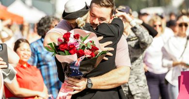 Lieutenant Rene Van Rooyen from HMAS Warramunga embraces her partner on the wharf of Fleet Base East, Sydney, on return from deployment.  Story by Lieutenant Nicole Gallie. Photo by Able Seaman Lucinda Allanson.