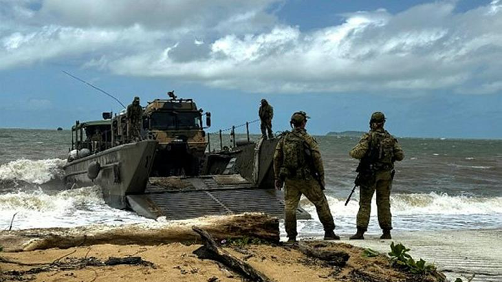 Army soldiers from 10th Force Support Battalion conduct a beach landing of an HX-40M during Exercise Green Anchor. Story by Captain Joanne Leca.
