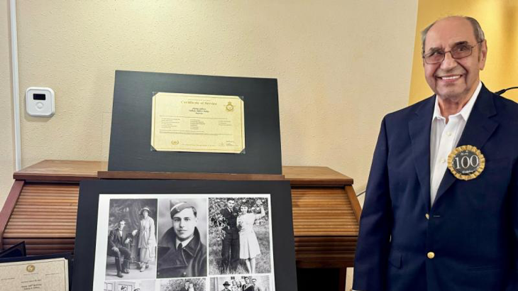 Former Flying Officer Sidney Mibus next to his service certificate, badge and World War 2 medals on his 100th birthday in Florida. Story by John Noble.