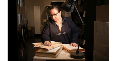 Nikki Dohnt, of the Military Police Central Records Office, sorts through archives in Canberra.