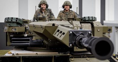 Chief of the German Army Lieutenant General Alfons Mais and Head of Equipment Department Ministry of Defence, Vice Admiral Carsten Stawitzki prepare to take a test drive of a Boxer combat reconnaissance vehicle at Rheinmetall Defense Australia, Brisbane, Queensland. Photo by Marc Dorow.