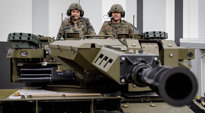 Chief of the German Army Lieutenant General Alfons Mais and Head of Equipment Department Ministry of Defence, Vice Admiral Carsten Stawitzki prepare to take a test drive of a Boxer combat reconnaissance vehicle at Rheinmetall Defense Australia, Brisbane, Queensland. Photo by Marc Dorow.