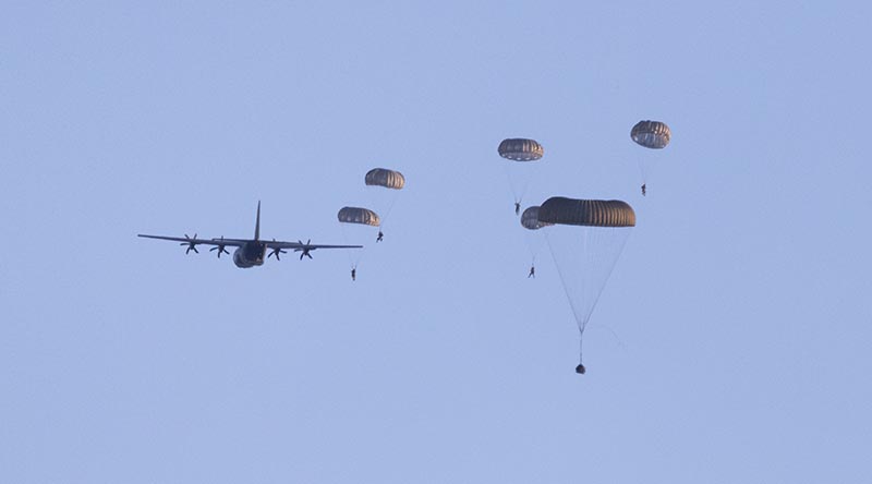 Australian Defence Force special operations force trainees from the ADF School of Special Operations conduct a parachute load-follow jump from a Royal Australian Air Force C-130J Hercules into water off Manly, Sydney, NSW. Photo by Able Seaman Benjamin Ricketts.