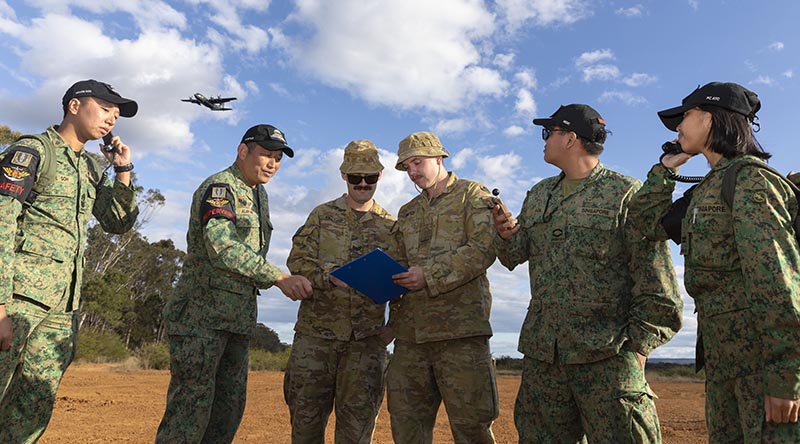 Soldiers from the Australian Army's 176 Air Dispatch Squadron work with Air Terminal Company, 3 Singapore Armed Forces Transport Battalion, during a Republic of Singapore Air Force C-130 training sortie. Photo by Aircraftwoman Maddison Scott.