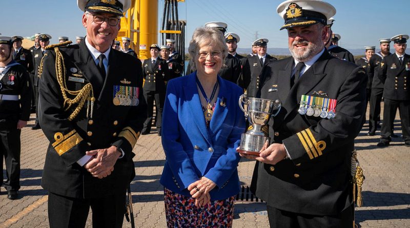 Commanding Officer HMAS Rankin Commander Simon O’Hehir holds the Gloucester Cup, accompanied by Commander of the Australian Fleet Rear Admiral Chris Smith and Governor of South Australia Frances Adamson. Story by Lieutenant Commander Andrew Ragless. Photo by Petty Officer Luke Scott.