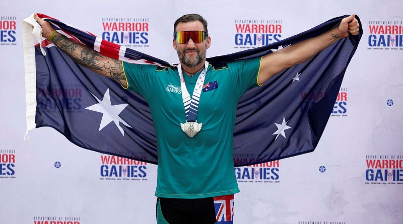 Nigel Coutts celebrates wining silver in the men’s road race during the cycling events at the 2024 Warrior Games at the ESPN Wide World of Sports Complex, Florida, US. Story Flying Officer Belinda Barker. Photo by Flight Sergeant Ricky Fuller.