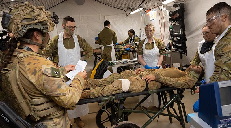 Australian Army medical specialists receive a simulated casualty in the Role 2 Basic resuscitation bay during Exercise Rhino Run at Cultana Training Area. Photo by Sergeant Matthew Bickerton.