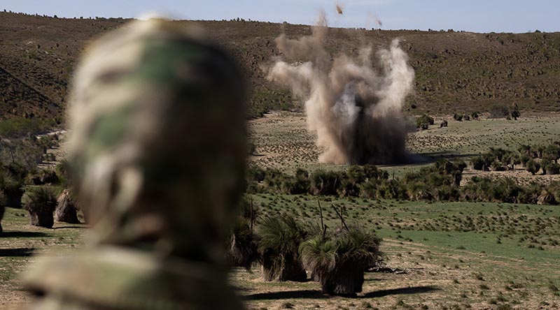 A Joint Explosive Ordnance Support - West member watches the blast of an explosive ordnance disposal task on farmland at Two Rocks, Western Australia. Photo by Petty Officer Craig Walton.