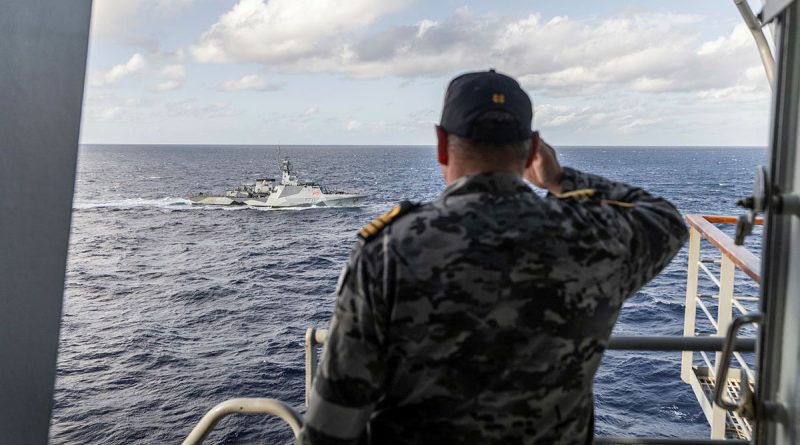 Commanding Officer of HMAS Choules Commander Arron Convery salutes HMS Tamar after successful Officer Of the Watch manoeuvres. Photo by Able Seaman Lucinda Allanson.